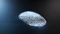 Glowing fingerprint with detailed ridges and patterns on dark background for security, identity verification and biometric authentication technology concepts.
