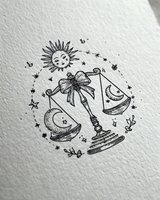 Mystical celestial balance scale with sun moon and stars hand drawn tattoo design on textured paper background for spiritual and esoteric themed projects.