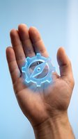 Open hand holding glowing blue gear with eye symbol representing automation, AI technology, and digital transformation against sky background.