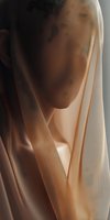 Soft peach silk fabric with elegant folds and gentle shadows creating a minimalist composition for fashion and textile design projects.