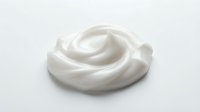 Creamy white whipped texture swirl isolated on light background, suitable for cosmetics, skincare, dairy, and beauty product packaging design.