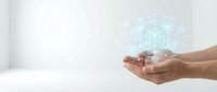 Hands holding glowing digital hologram of geometric cube structure on white background, representing technology innovation and data visualization.