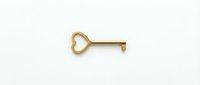 Golden heart-shaped key isolated on white background, symbolizing love, security, and access, perfect for Valentine's Day and romance concepts.