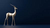 Elegant golden deer figurine with antlers standing against deep navy blue background, showcasing luxury home decor element.