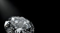 Brilliant cut diamond with sparkling facets on black background for luxury jewelry and engagement ring designs.