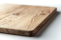 Natural wooden cutting board with visible wood grain texture and knots on white background, minimalist kitchen accessory for food preparation and serving.