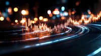 Financial market graph overlay on blurred city lights and traffic trails at night, combining stock trading data with urban motion in blue and orange tones.