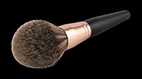 Fluffy powder makeup brush with rose gold ferrule and black handle, isolated on transparent background. Great for beauty clipart, stickers, t-shirt design, and print on demand.