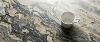 Overhead view of white ceramic mug on marble countertop with natural veining patterns, suitable for beverage, kitchen, and lifestyle design projects.