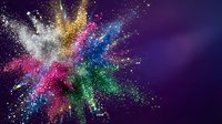 Colorful powder explosion with white, gold, pink, blue and green particles dispersing against dark purple background, suitable for creative design projects.