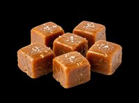 Salted caramel fudge cubes isolated on transparent background, ready for stickers, t-shirt design, print on demand, clipart, and sublimation projects.