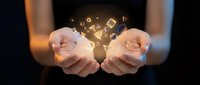 Hands holding glowing digital icons and symbols, representing data exchange, technology innovation, and business connectivity in modern digital environment.