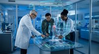 Three diverse medical professionals analyzing holographic data display in modern laboratory facility for healthcare technology research and development.