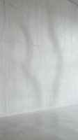 Modern concrete wall corner with smooth gray surface and industrial minimalist design for contemporary architecture and interior backgrounds.