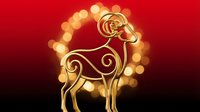 Golden goat silhouette with glowing bokeh lights on red and black gradient background, suitable for festive holiday designs and celebrations.