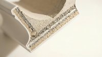 Concrete construction block with visible aggregate texture and smooth edges for building materials and industrial architecture projects.