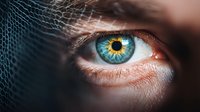 Extreme close-up of striking blue human eye with detailed iris pattern and reflection, dramatic lighting creates mysterious atmosphere. For medical, beauty or vision concepts.