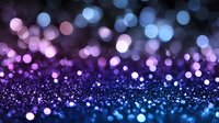 Magical glowing bokeh lights in purple and blue colors creating dreamy abstract background with blurred sparkles and defocused circles for festive designs.
