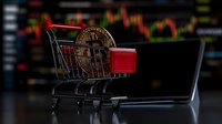 Golden cryptocurrency coin in miniature shopping cart against blurred trading chart background, symbolizing digital currency market and commerce.