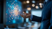 Professional in navy suit extends hand with magical glowing particles floating above palm, creating ethereal bokeh effect against blurred blue background.
