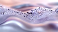 Water droplets and condensation on smooth wavy metallic surface with pink and purple reflections creating abstract macro photography pattern.