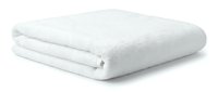 Soft white fluffy folded bath towel isolated on white background, showcasing clean cotton texture for spa, hotel, and bathroom concepts.