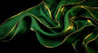 Luxurious emerald green silk fabric with golden edges flowing in elegant waves against black background for premium textile and fashion design.