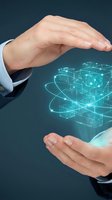Two hands of a Caucasian male professional in business attire cradling glowing digital network structure, symbolizing data protection, technology innovation, and secure digital transformation for enterprise solutions.