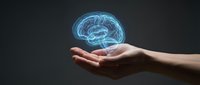 Human hands holding glowing blue brain hologram against dark background representing artificial intelligence, neuroscience and mental health concepts.