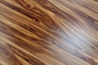 Diagonal wood grain pattern in brown and beige tones creates natural texture background with flowing lines and knots for interior design projects.