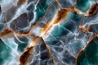 Natural stone texture with dramatic cracks and veins in turquoise, orange and gray colors showing luxurious marble or onyx surface pattern.