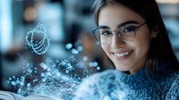 Young Asian woman in glasses and sweater smiling while interacting with glowing digital network visualization and floating data points in modern office environment.