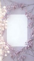 Blank white card surrounded by delicate pink flowers and warm fairy lights on soft purple background for wedding invitations or romantic messages.