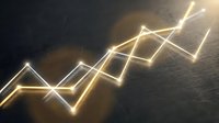 Glowing neon upward trending arrow chart on dark textured surface, representing financial growth, stock market success, and business performance metrics.