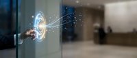 Businessman touching futuristic holographic interface with glowing digital network connections in modern office environment for technology presentations.