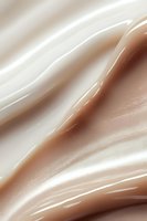 Smooth flowing abstract waves in cream and chocolate brown colors create luxurious satin texture background with gentle highlights and soft gradients.