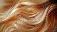 Flowing waves of golden blonde hair with honey highlights creating a luxurious texture pattern for beauty and hair care industry use.