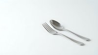 Stainless steel fork and spoon set on white background, isolated cutlery for kitchen dining table setting and restaurant use.