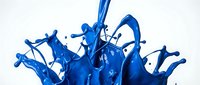 Dynamic blue paint splash frozen in motion on white background, vivid liquid explosion with droplets for creative design use.