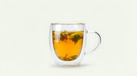 Herbal tea with mint leaves in double-walled glass mug on white background, isolated for beverage, wellness, and cafe design use.