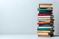 Stack of colorful vintage hardcover books arranged vertically against light gray background, creating minimalist composition with copy space for education concepts.