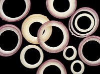 Scattered red and white onion rings isolated on transparent background, ready for stickers, T-shirt design, print on demand, sublimation, and food clipart projects.