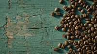 Roasted coffee beans scattered on weathered turquoise wooden surface with peeling paint, overhead flat lay composition for cafe, beverage, and food industry marketing materials.