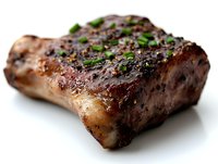 Juicy grilled beef short rib seasoned with black pepper and fresh herbs on white background, close-up view showing caramelized crust and tender meat texture.