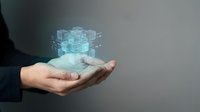Caucasian male hand holding glowing digital cube wireframe structure representing technology, data, innovation, and business solutions for corporate presentations.