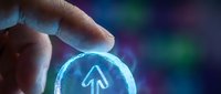 Caucasian male hand holding glowing blue circular icon with upward arrow symbol, representing digital navigation, technology advancement, and growth direction in modern business applications.