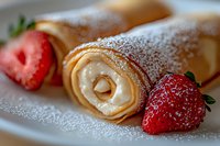 Delicate crepes rolled with cream cheese filling, dusted with powdered sugar and served with fresh strawberries on white plate, macro food photography.