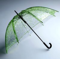 Transparent green umbrella with water drops against gray background, black handle and frame, elegant rain protection accessory showing refreshing wetness.