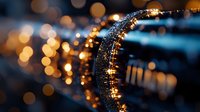 Sparkling golden lights create magical bokeh effect with glittering particles flowing in elegant curve against dark blurred background for luxury design.