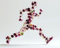 Running figure silhouette made of burgundy and pink flowers, green leaves on white background. Creative sports and wellness concept for natural fitness.